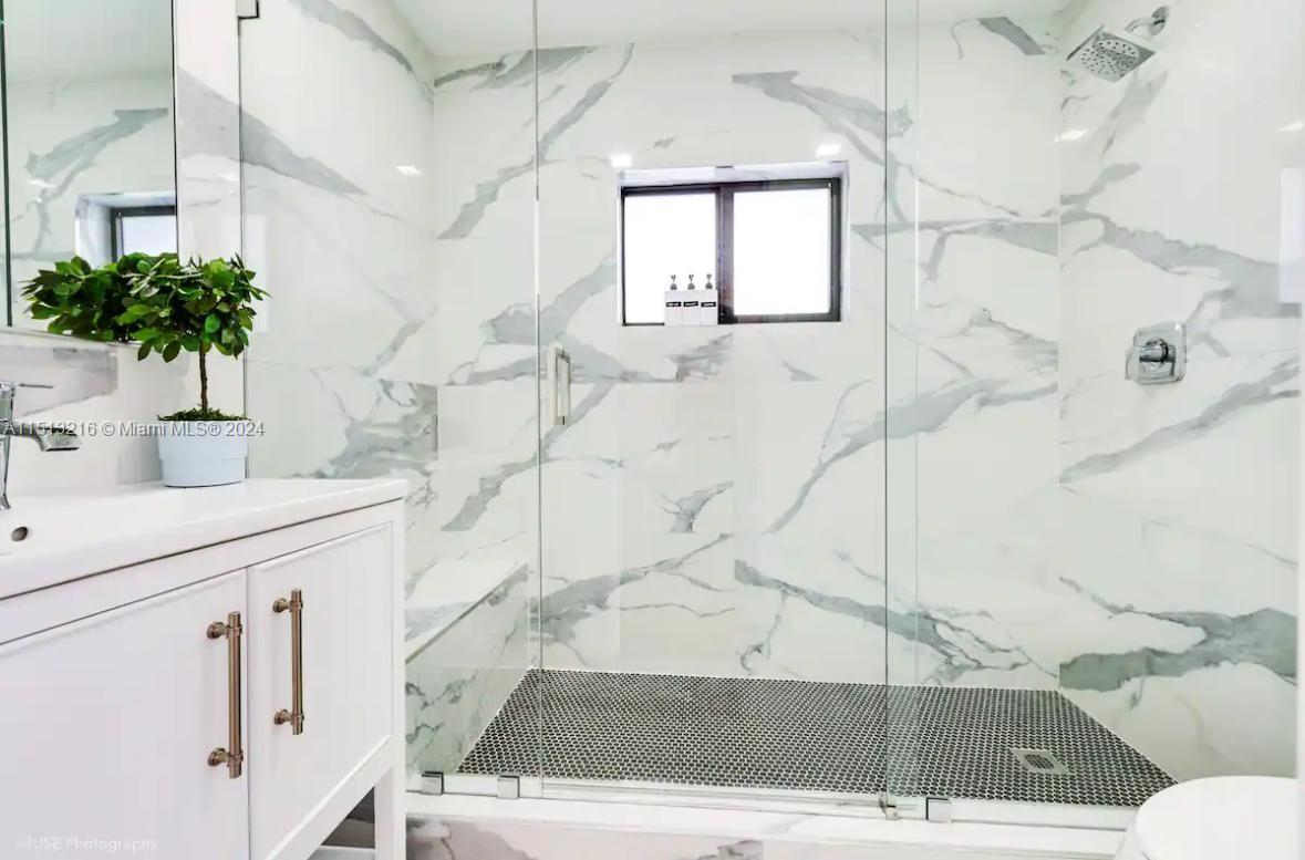 4021 Southwest 124th Court Miami, FL 33175 - Photo 8 of 8 a bathroom with a sink and mirror