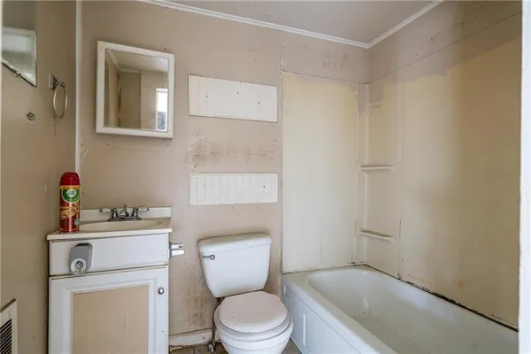 a bathroom with a toilet and a sink