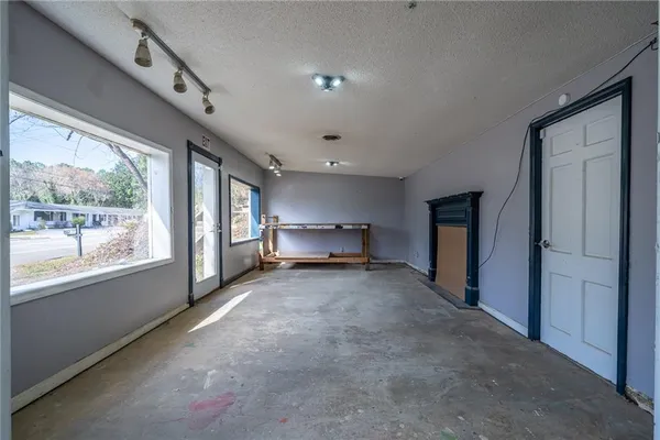 a view of a hallway with an entryway