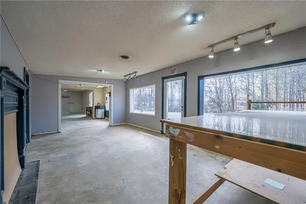 a view of empty room with a fireplace