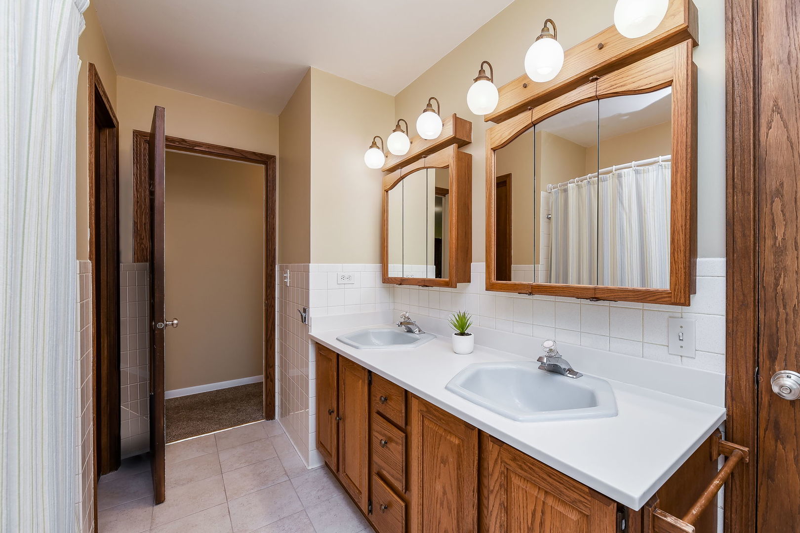 N150 County Farm Road Winfield, IL 60190 - Photo 11 of 22 a bathroom with a sink and a mirror