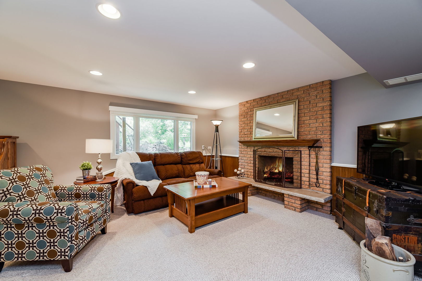 N150 County Farm Road Winfield, IL 60190 - Photo 12 of 22 a living room with furniture a fireplace and a flat screen tv