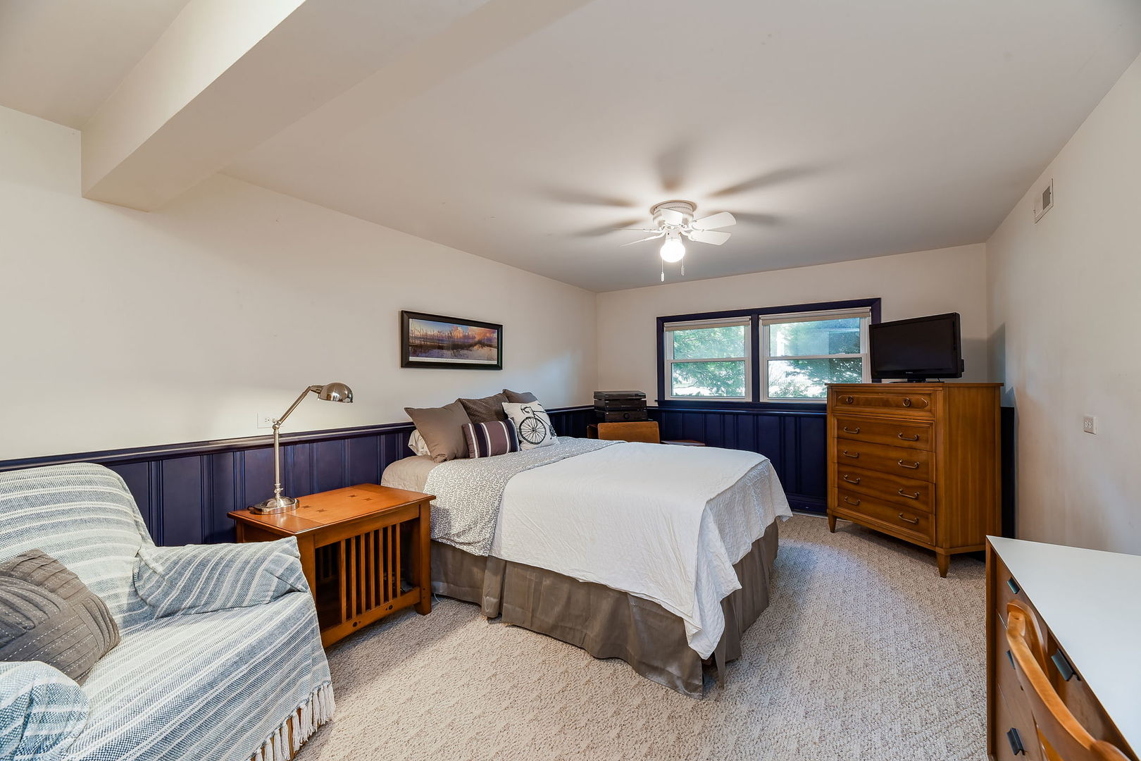 N150 County Farm Road Winfield, IL 60190 - Photo 16 of 22 a bed room with furniture and a flat screen tv