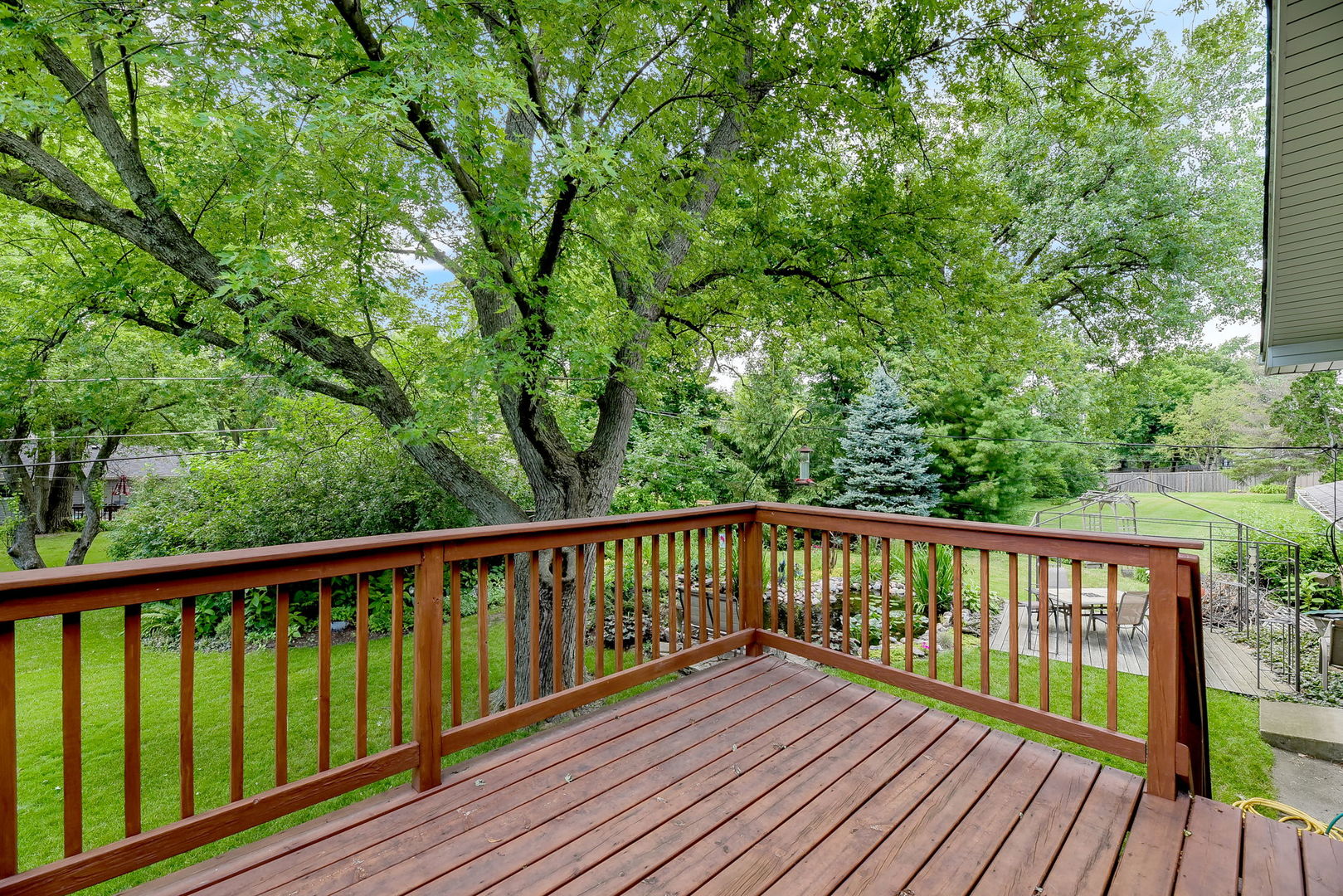 N150 County Farm Road Winfield, IL 60190 - Photo 19 of 22 a view of balcony with wooden floor and fence