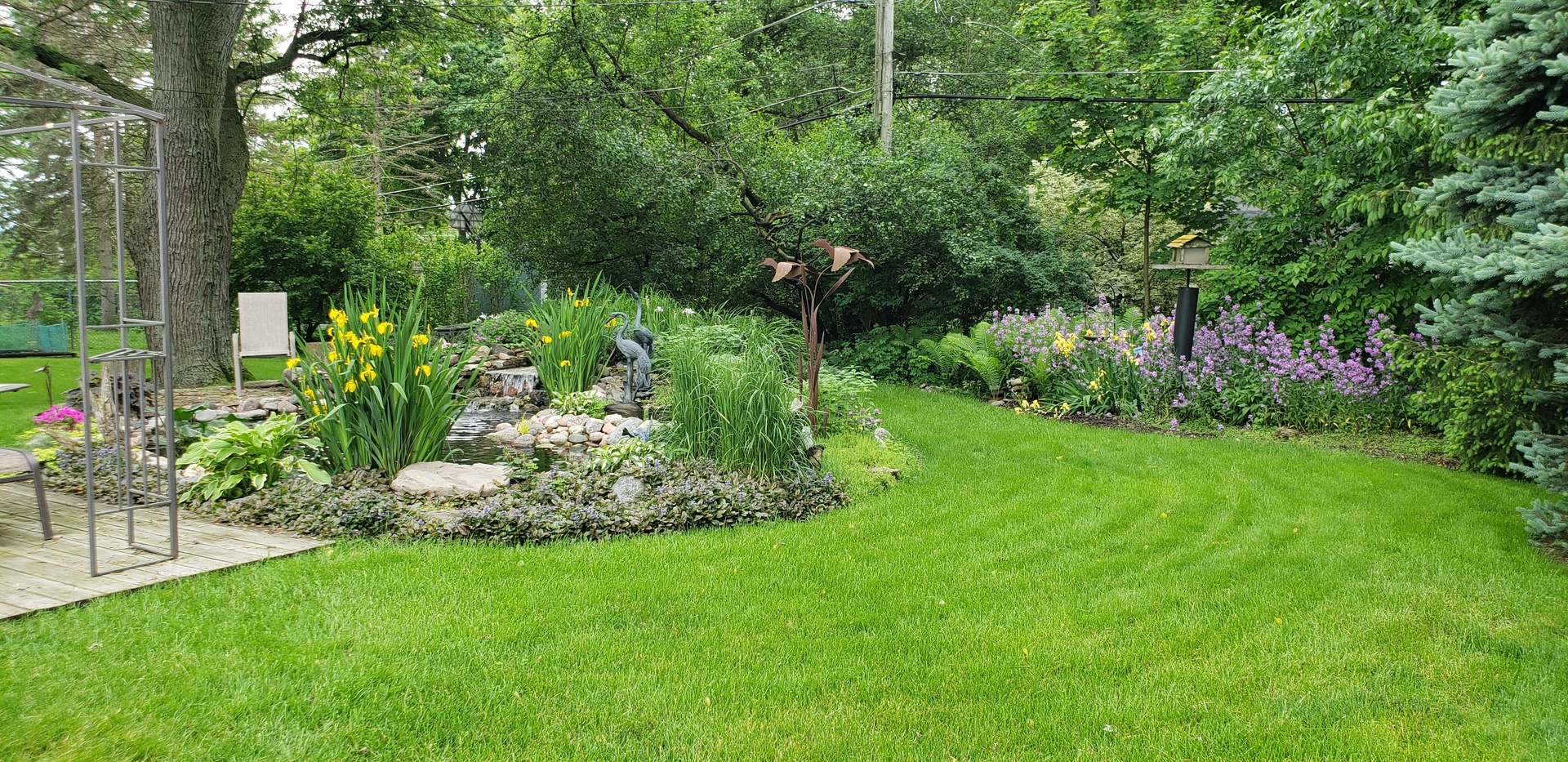 N150 County Farm Road Winfield, IL 60190 - Photo 21 of 22 a view of a garden with a bench