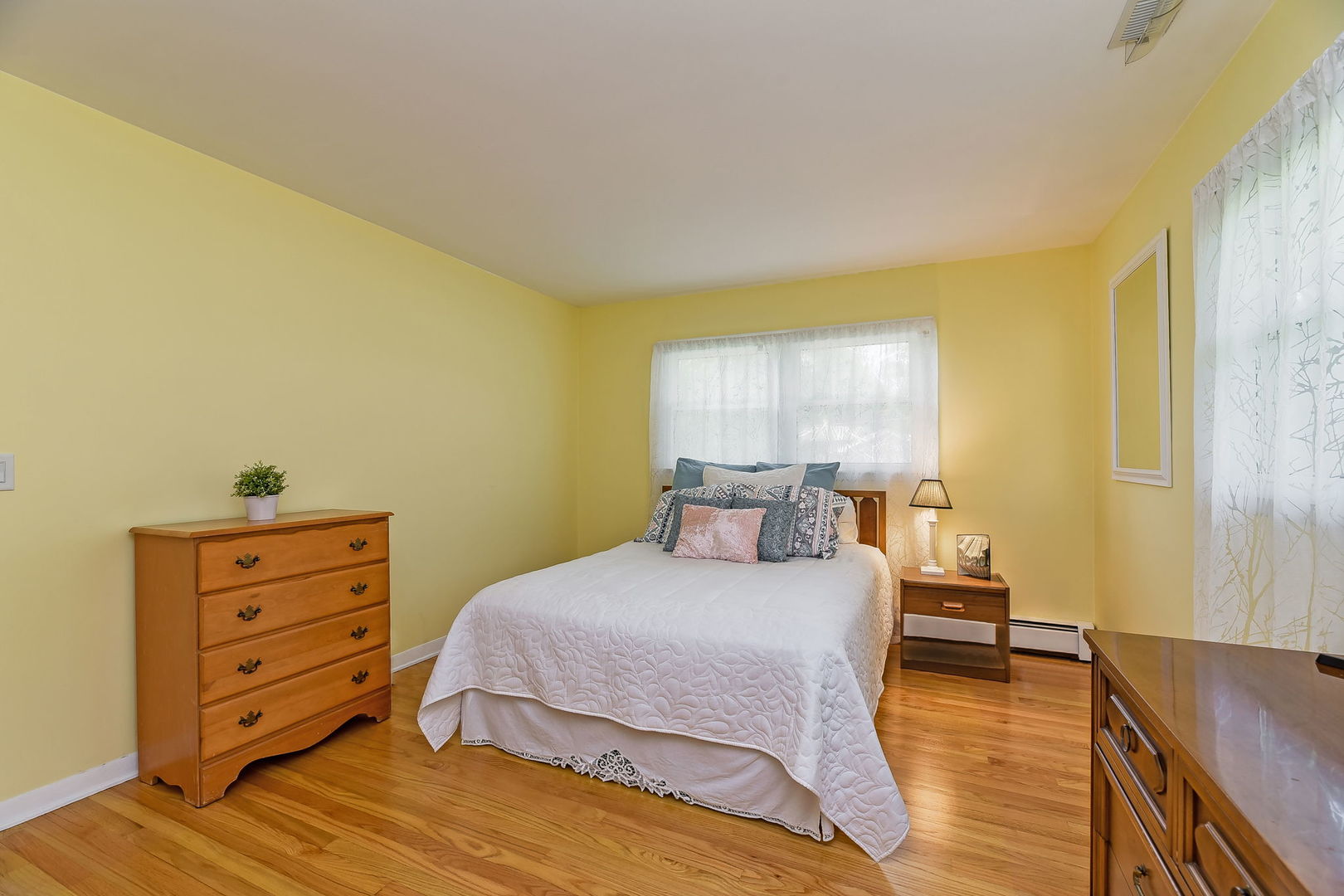 N150 County Farm Road Winfield, IL 60190 - Photo 8 of 22 a bedroom with a bed and a dresser