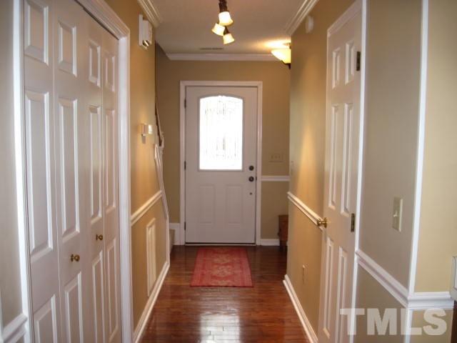 3537 Singleleaf Lane Raleigh, NC 27616 - Photo 2 of 21 a view of a hallway with a wooden door