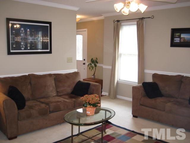 3537 Singleleaf Lane Raleigh, NC 27616 - Photo 11 of 21 a living room with furniture and a large window