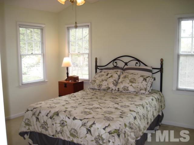 3537 Singleleaf Lane Raleigh, NC 27616 - Photo 12 of 21 a large bed sitting in a bedroom next to a window