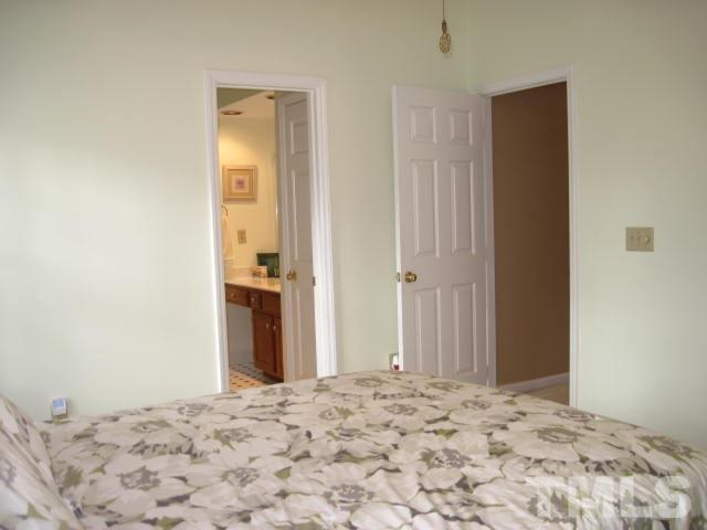 3537 Singleleaf Lane Raleigh, NC 27616 - Photo 13 of 21 a bedroom with a bed and a window