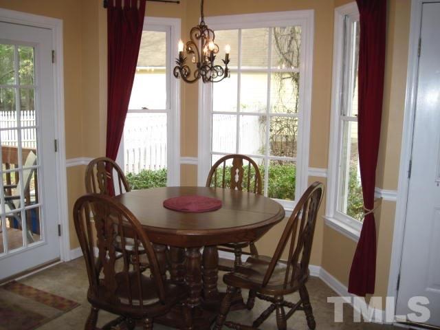 3537 Singleleaf Lane Raleigh, NC 27616 - Photo 6 of 21 a view of a dining room with furniture window and outside view
