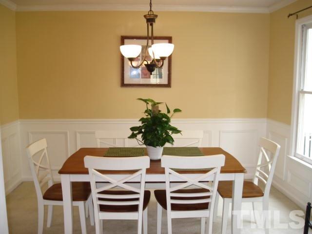 3537 Singleleaf Lane Raleigh, NC 27616 - Photo 7 of 21 a view of a dining room with furniture and wooden floor