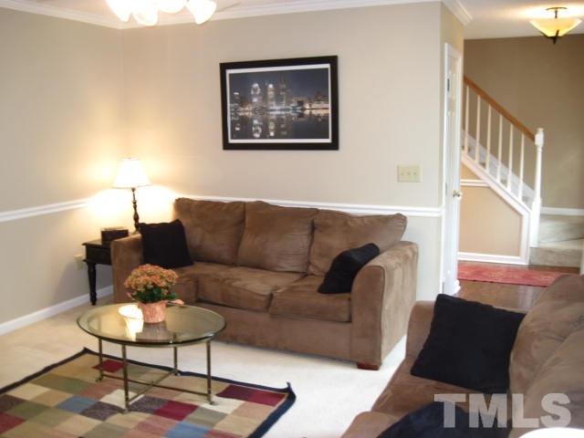 3537 Singleleaf Lane Raleigh, NC 27616 - Photo 10 of 21 a living room with furniture and a rug