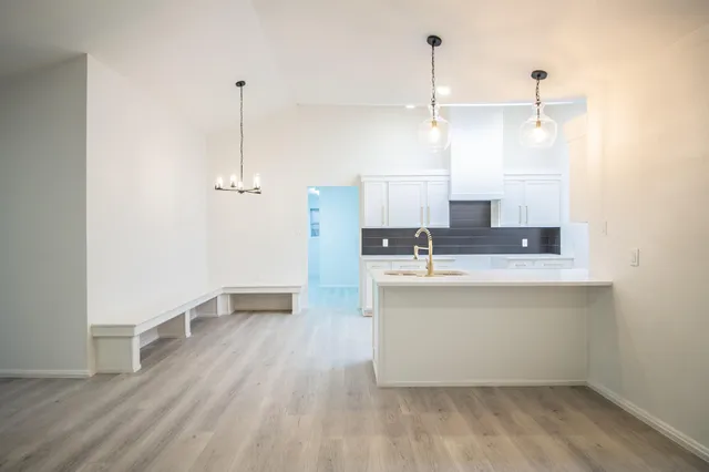 a bathroom with a sink a mirror and shower