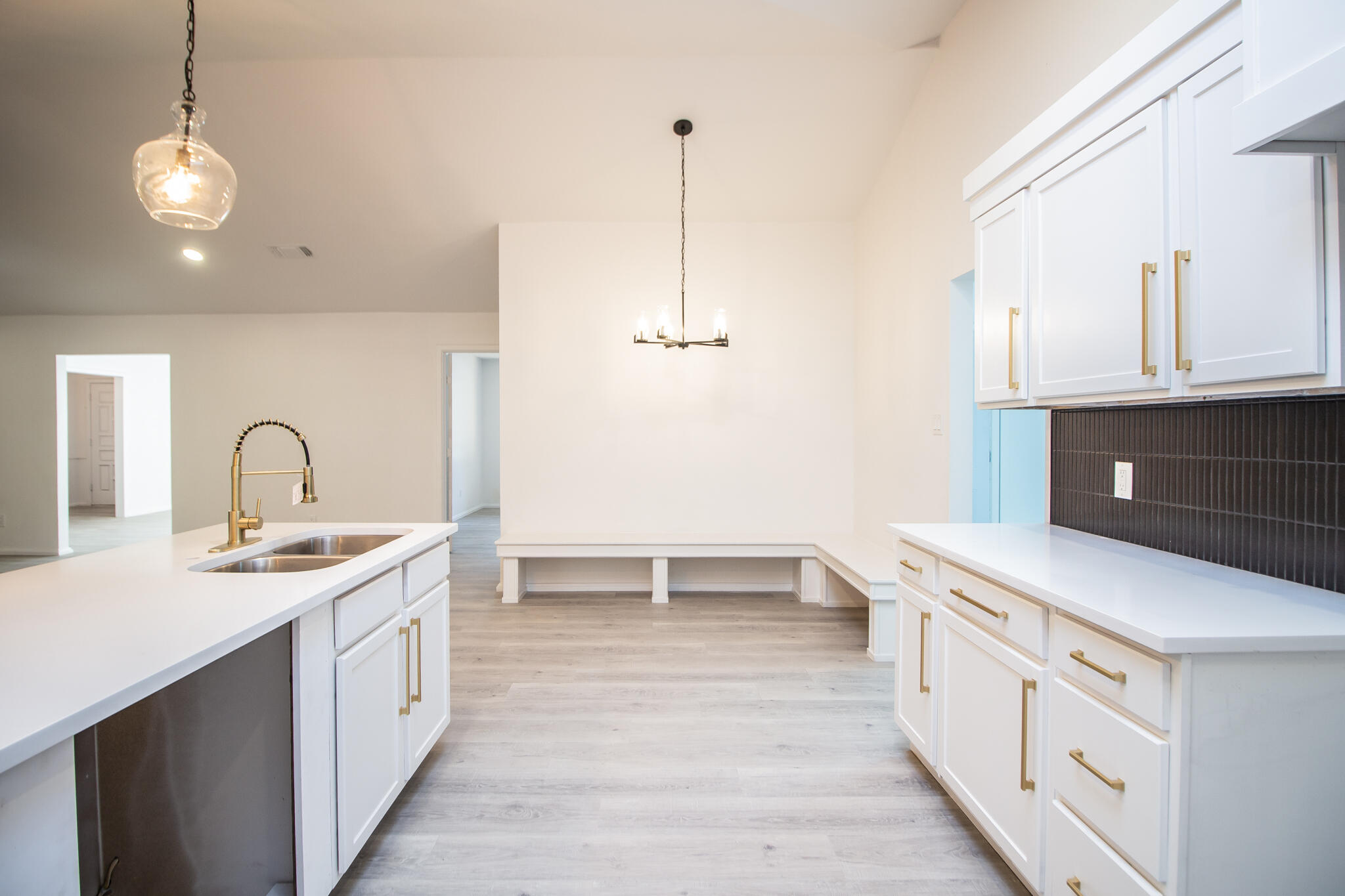 3602 63rd Drive Lubbock, TX 79413 - Photo 14 of 33 a kitchen that has a lot of cabinets in it and wooden floor
