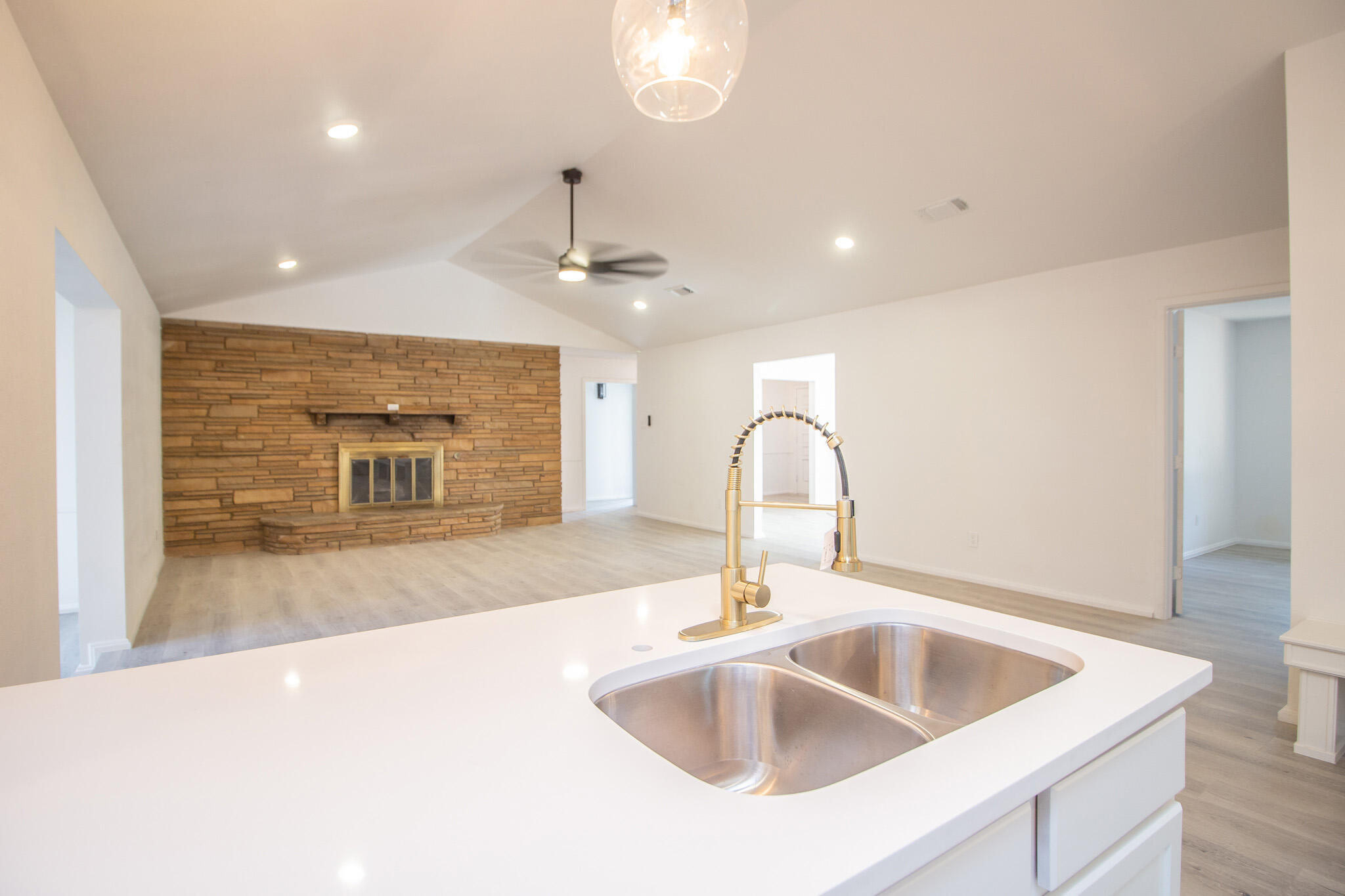 3602 63rd Drive Lubbock, TX 79413 - Photo 15 of 33 a kitchen with kitchen island a sink stainless steel appliances and a counter top space