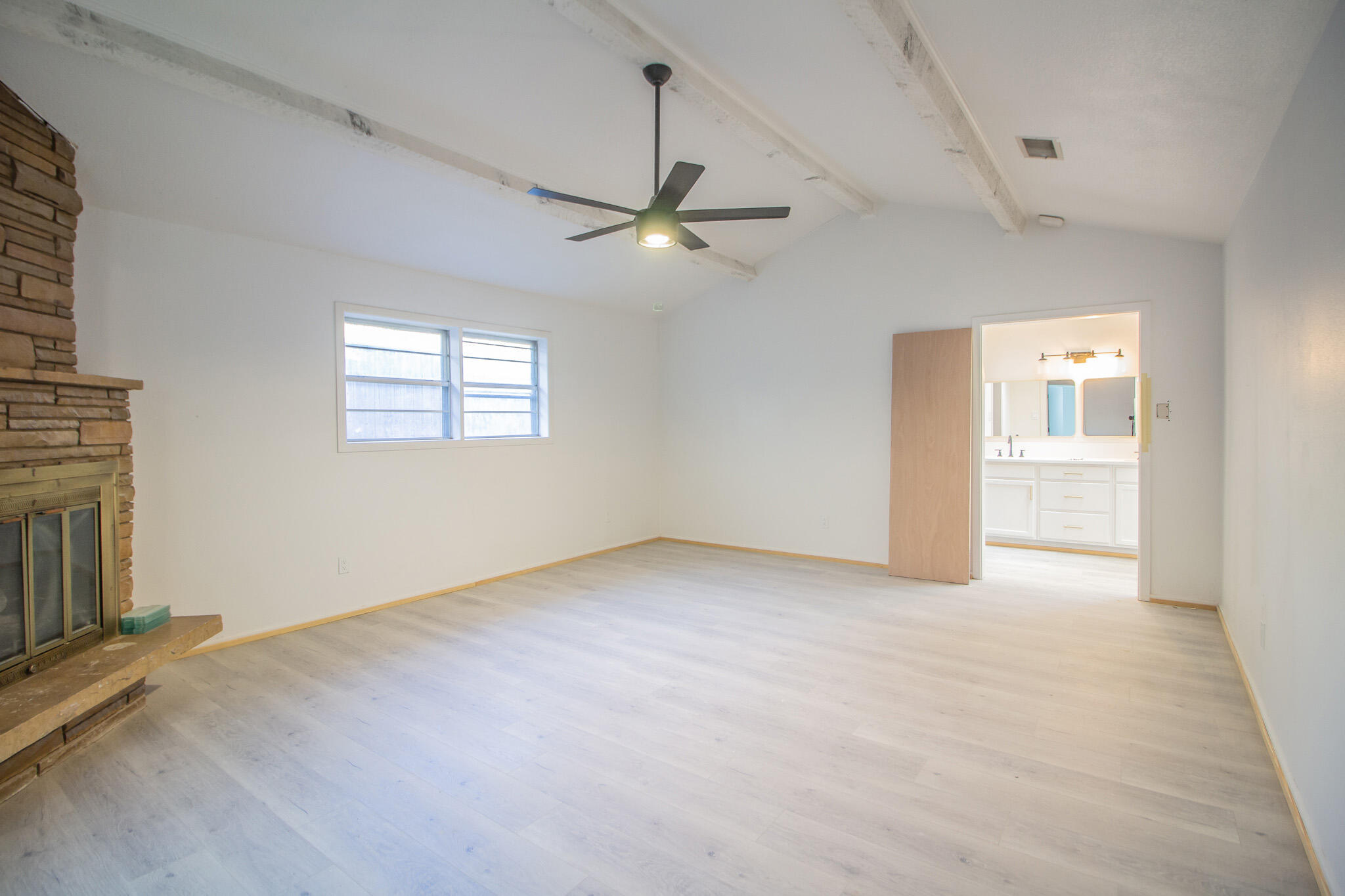 3602 63rd Drive Lubbock, TX 79413 - Photo 16 of 33 an empty room with fan and windows
