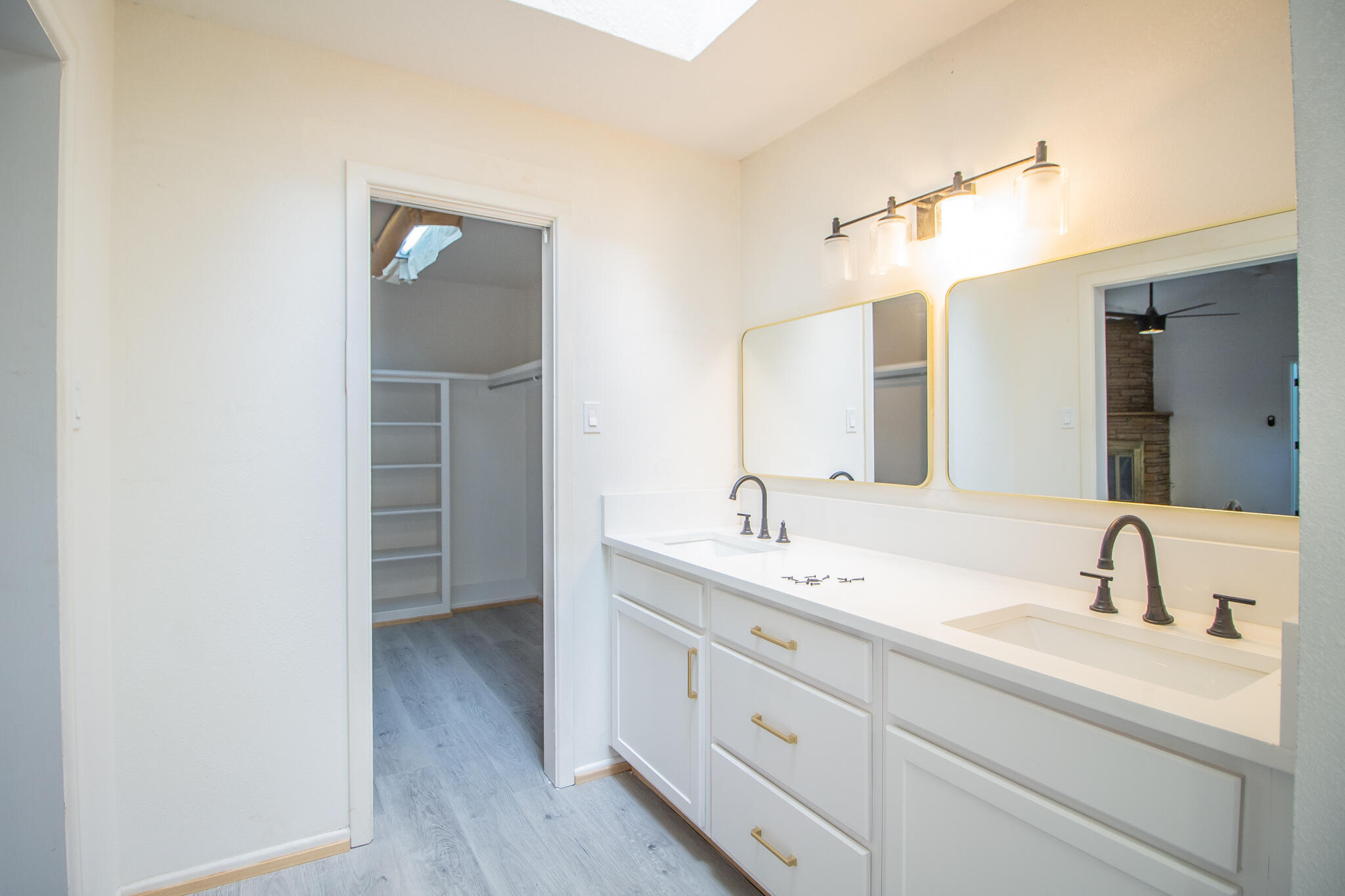 3602 63rd Drive Lubbock, TX 79413 - Photo 19 of 33 a bathroom with a sink and a mirror
