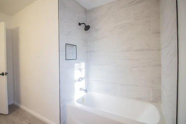 a close up of a bathtub curtain