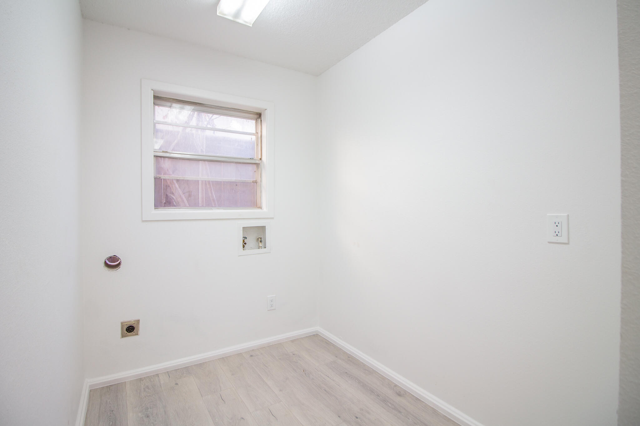 3602 63rd Drive Lubbock, TX 79413 - Photo 30 of 33 a view of a small space with wooden floor and a window