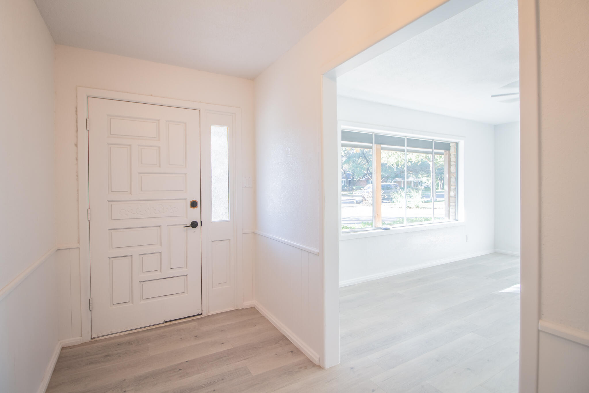 3602 63rd Drive Lubbock, TX 79413 - Photo 5 of 33 an empty room with wooden floor closet and windows