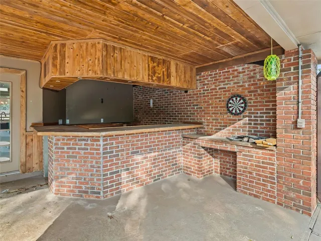 a view of a park with iron fence