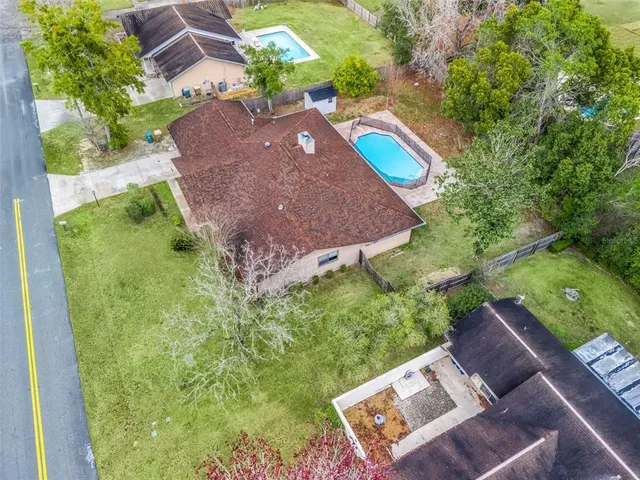 an aerial view of a house with a garden