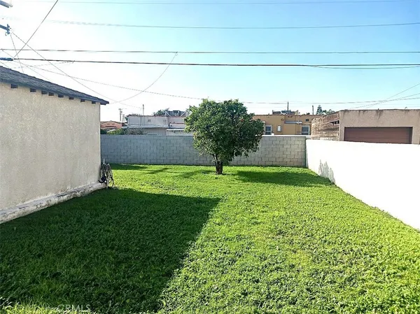 a view of a garden with a building