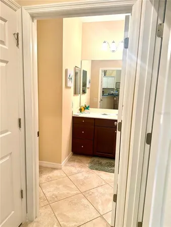 a bathroom with a toilet sink and shower curtain