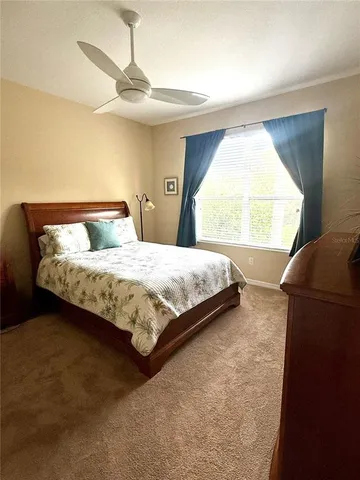 a water view with boat and trees in the background