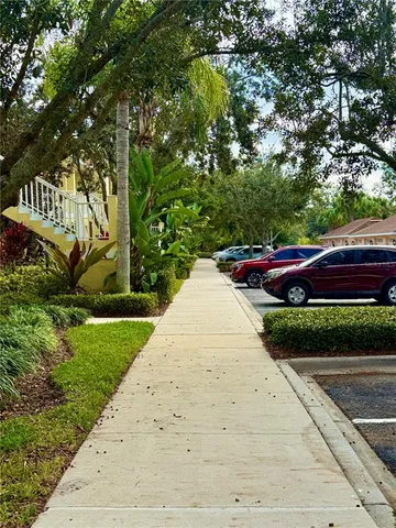 a kitchen with white cabinets a sink and appliances