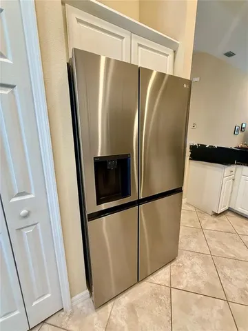 a bathroom with a vanity mirror and a bathtub
