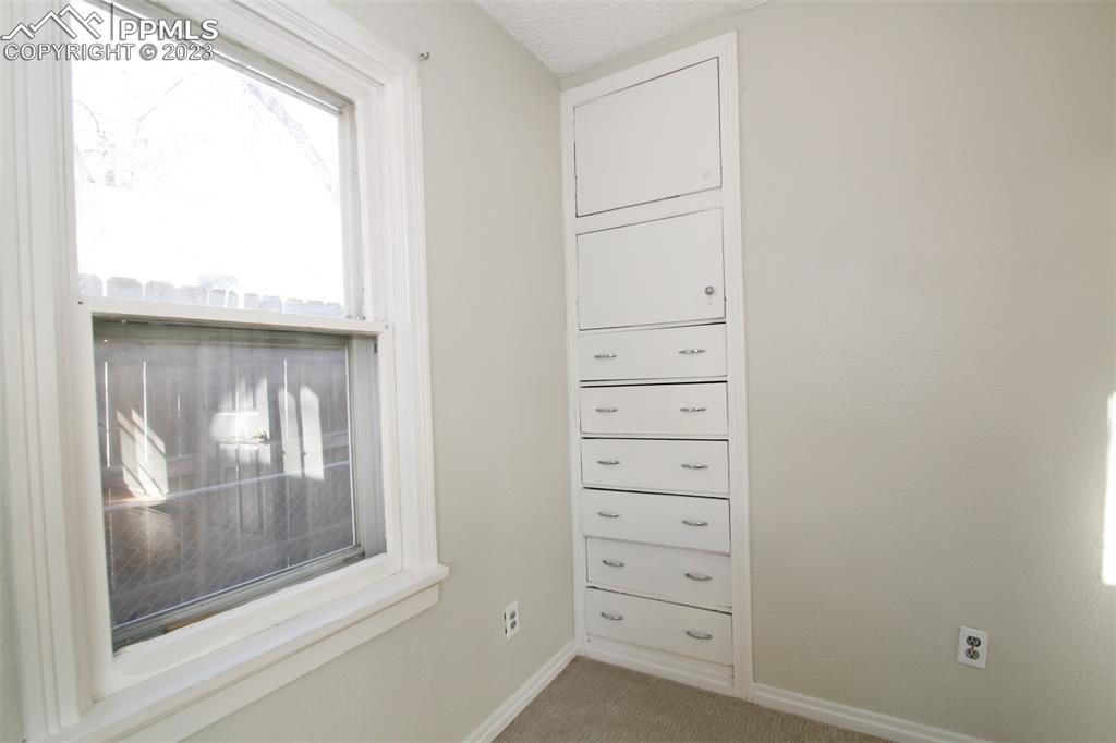 915 Alexander Road Colorado Springs, CO 80909 - Photo 11 of 24 a view of a dresser