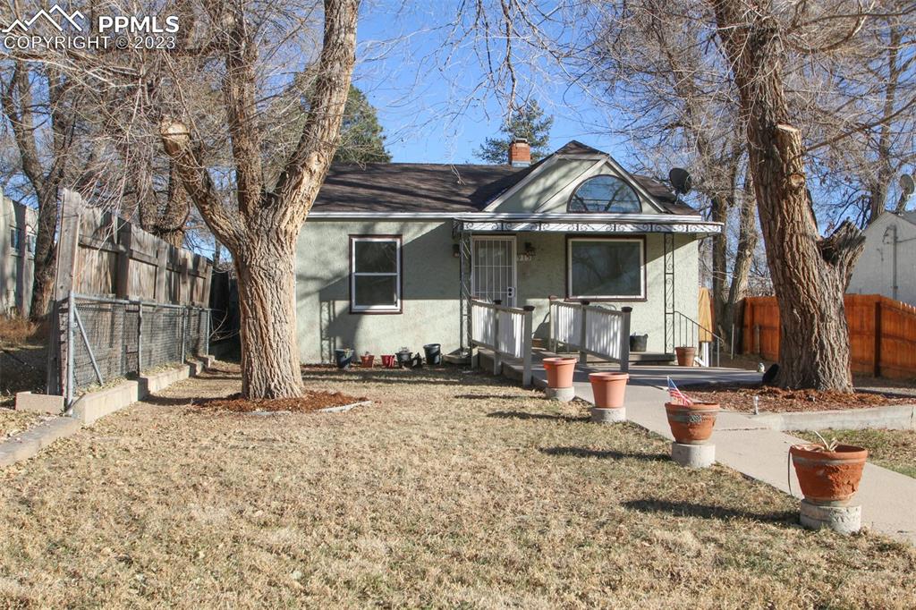 915 Alexander Road Colorado Springs, CO 80909 - Photo 2 of 24 a view of a house with snow on the ground