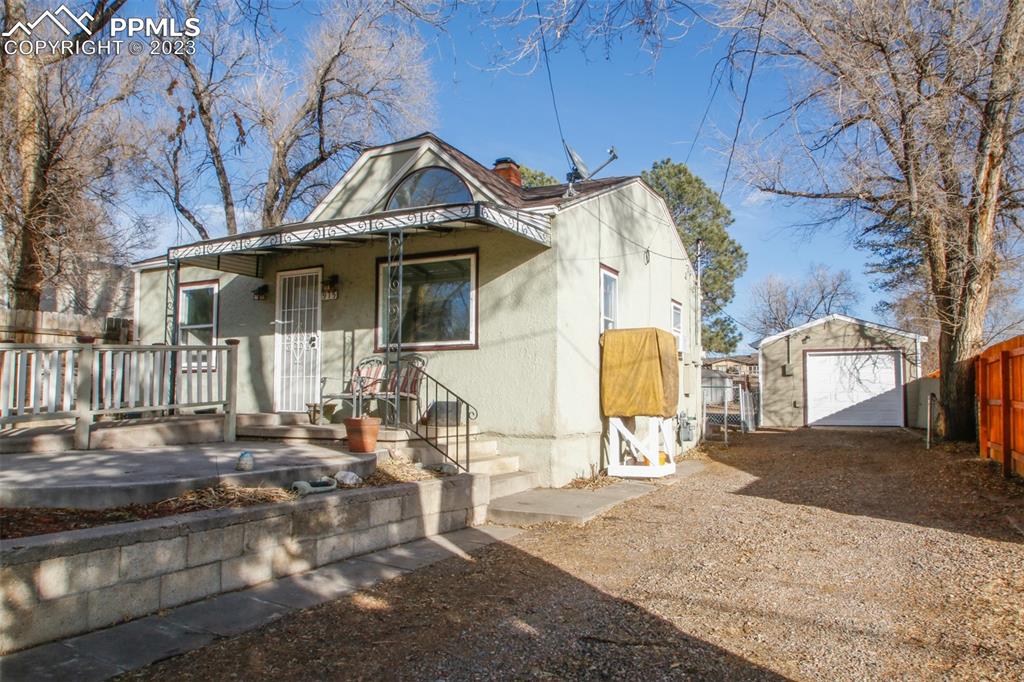 915 Alexander Road Colorado Springs, CO 80909 - Photo 4 of 24 a front view of a house with a yard
