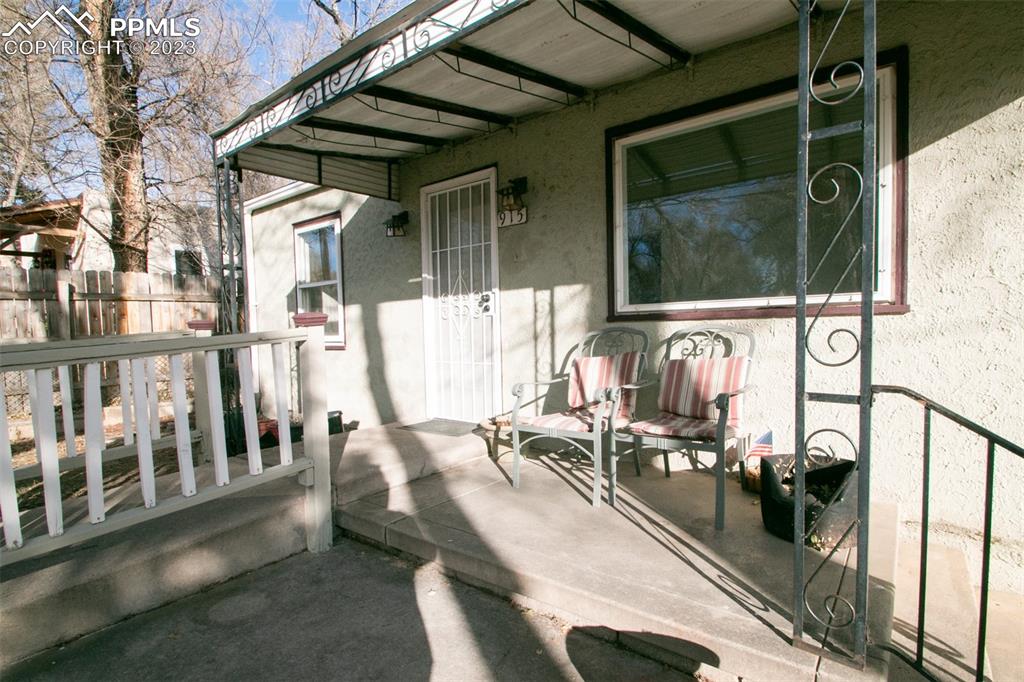 915 Alexander Road Colorado Springs, CO 80909 - Photo 5 of 24 a view of a balcony with chairs