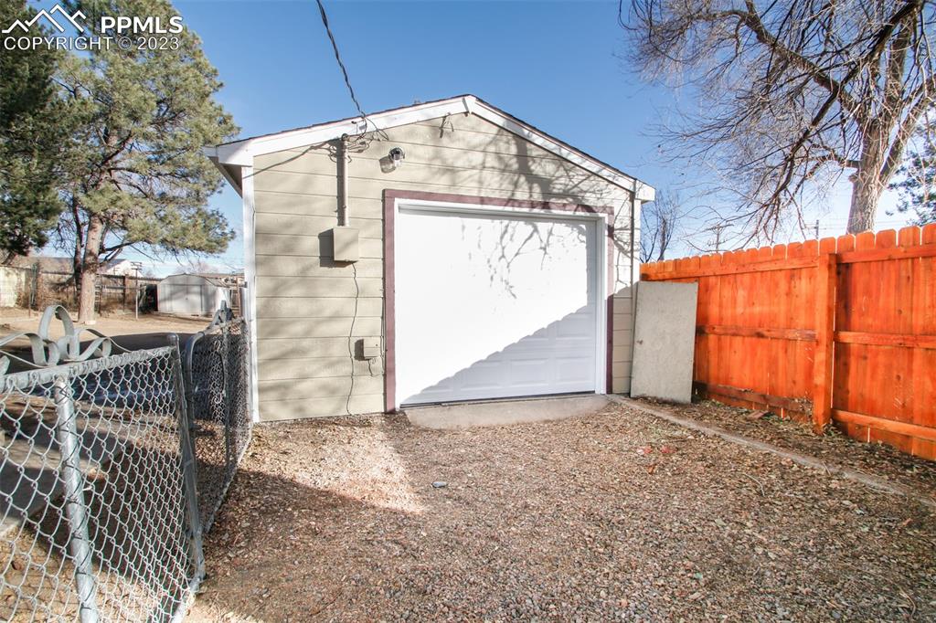 915 Alexander Road Colorado Springs, CO 80909 - Photo 6 of 24 a view of a house with a yard