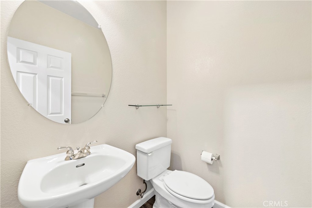 158 North Brea Boulevard Brea, CA 92821 - Photo 13 of 20 a bathroom with a toilet a sink and mirror