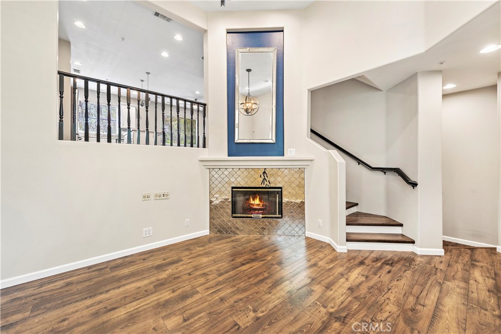 158 North Brea Boulevard Brea, CA 92821 - Photo 7 of 20 a view of staircase and kitchen with fireplace