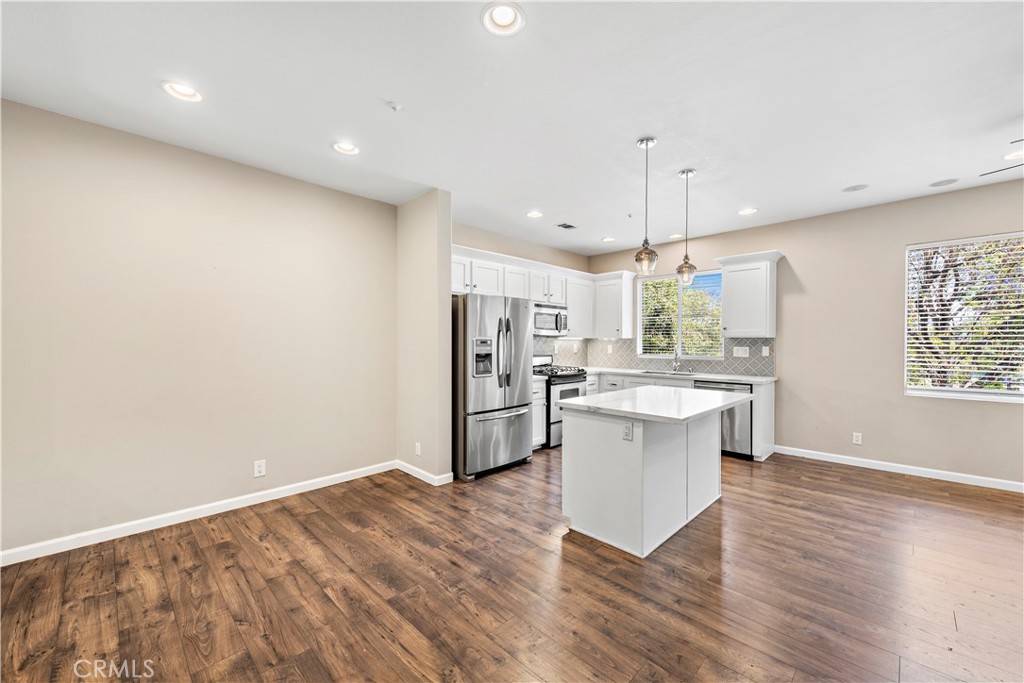 158 North Brea Boulevard Brea, CA 92821 - Photo 9 of 20 a kitchen with a refrigerator and a sink