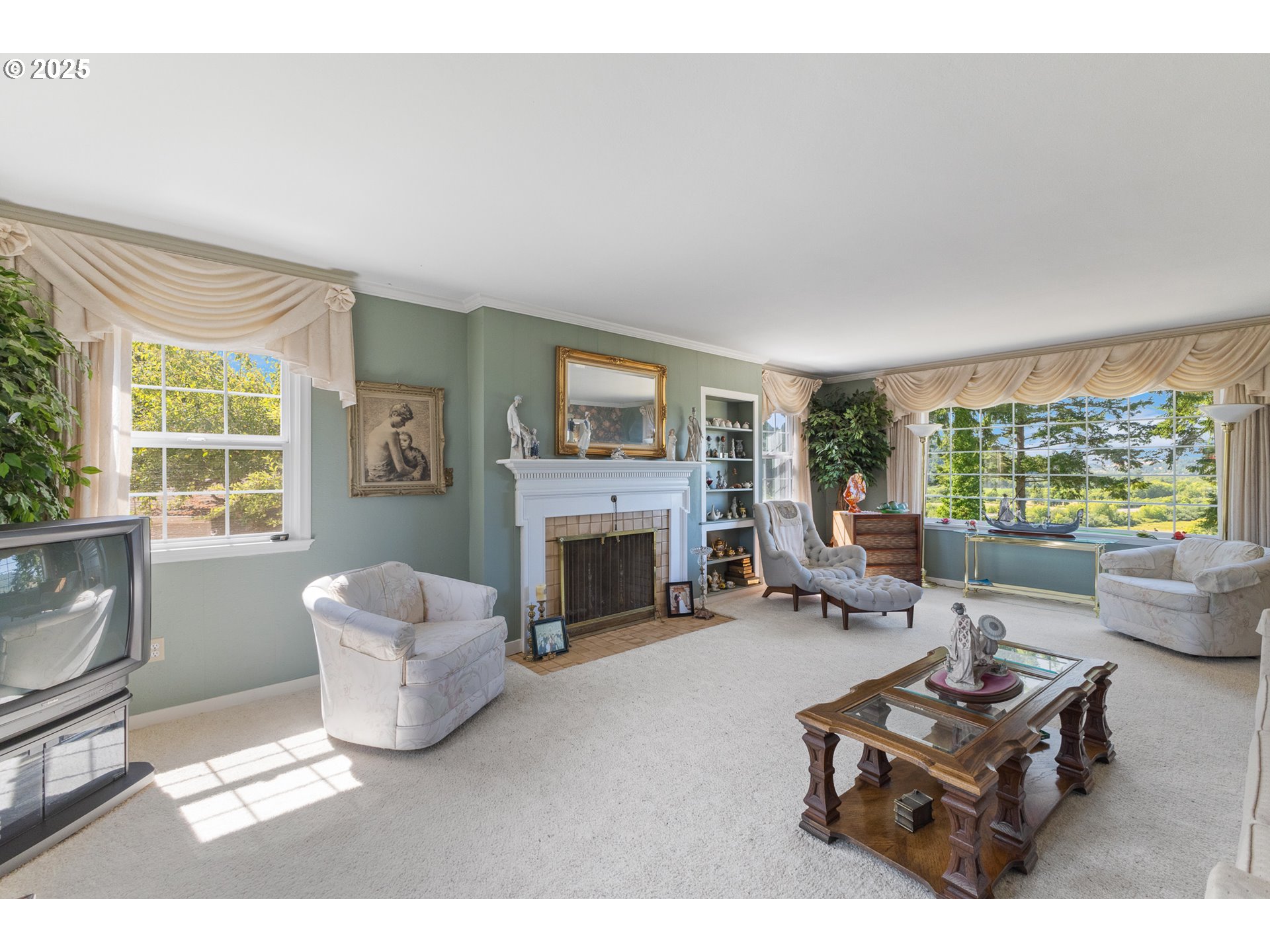 1211 Fairview Street Myrtle Point, OR 97458 - Photo 11 of 48 a living room with furniture a fireplace and a large window