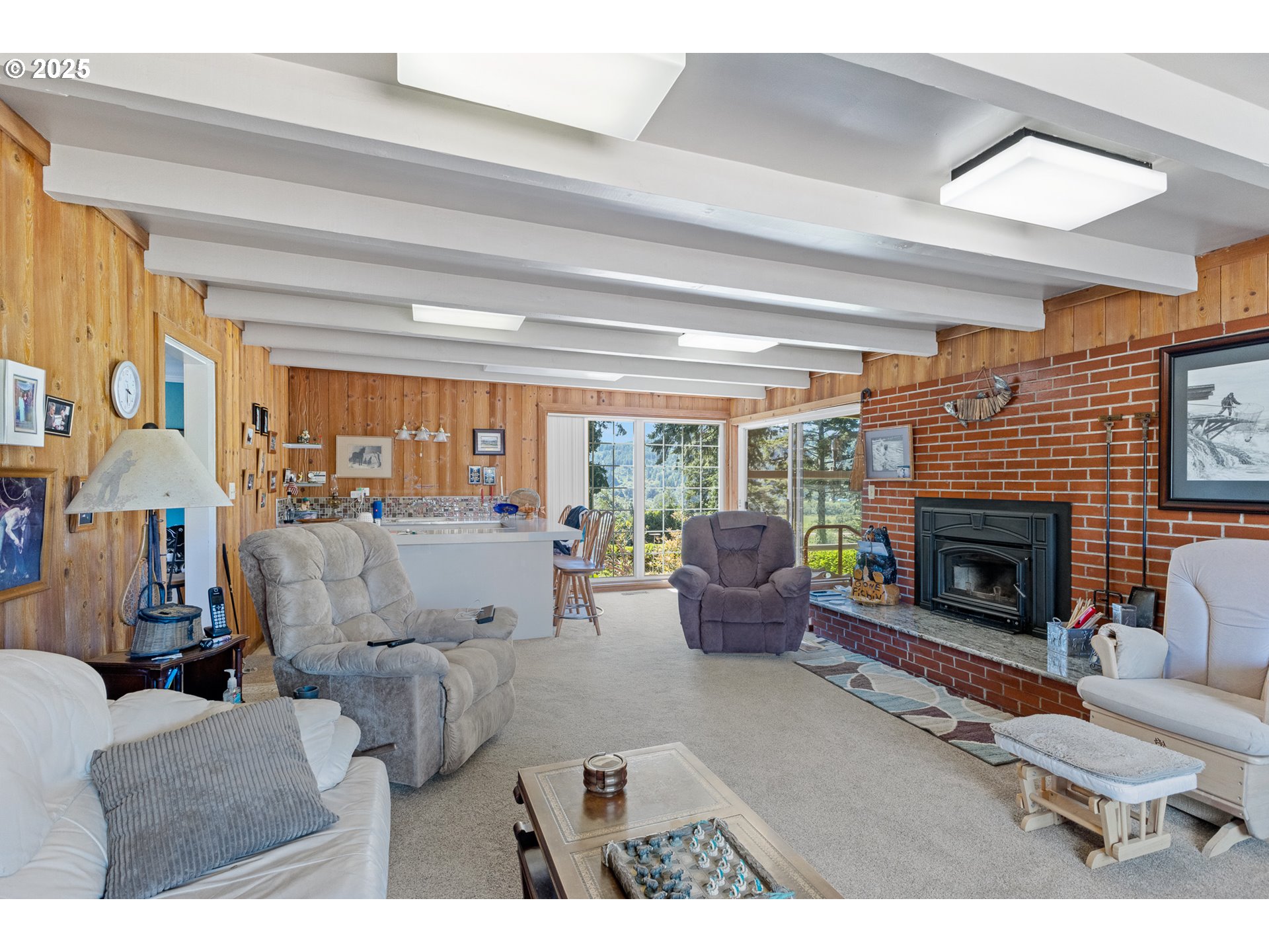 1211 Fairview Street Myrtle Point, OR 97458 - Photo 24 of 48 a living room with furniture large window and a fireplace