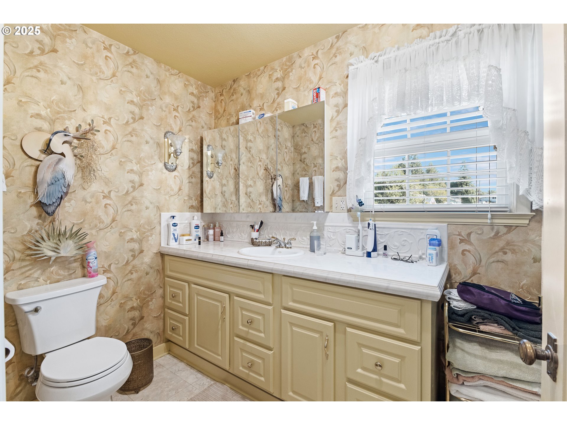 1211 Fairview Street Myrtle Point, OR 97458 - Photo 28 of 48 a bathroom with a granite countertop sink mirror vanity and toilet
