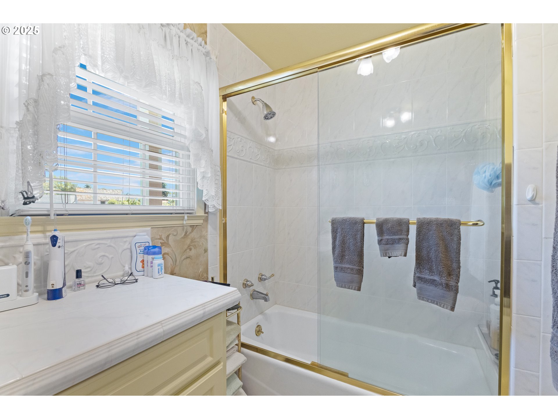 1211 Fairview Street Myrtle Point, OR 97458 - Photo 29 of 48 a bathroom with a sink and a large mirror