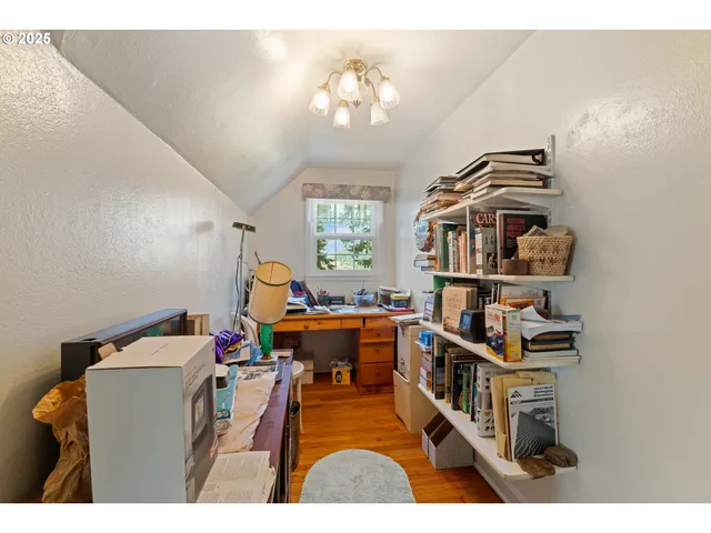 a bedroom with furniture and a book shelf