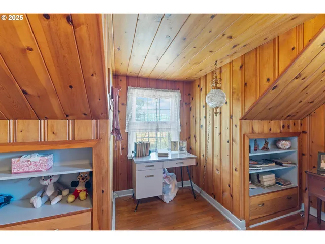 a bathroom with a sink mirror and tub