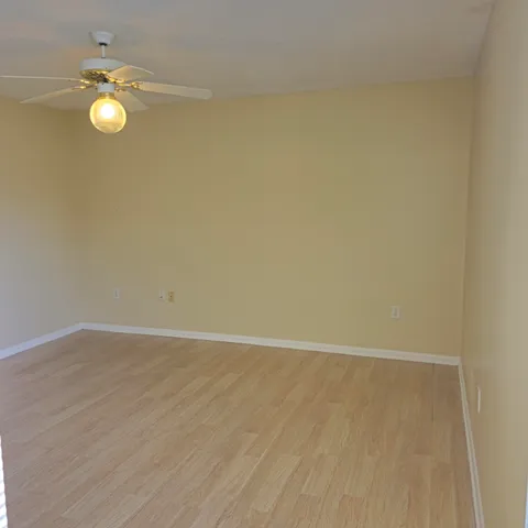 an empty room with wooden floor