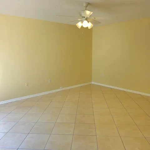 a view of an empty room with a fan