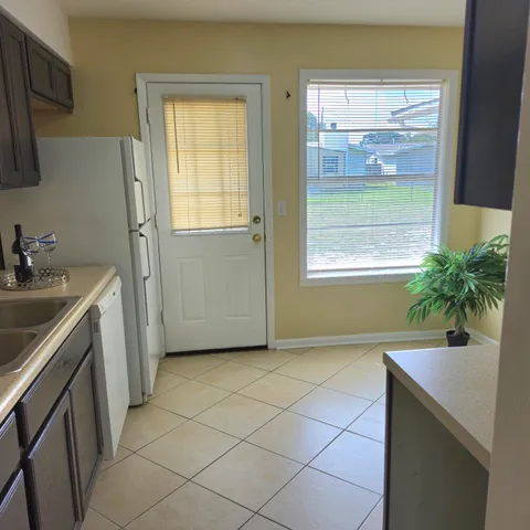 a bathroom with a sink toilet and tub