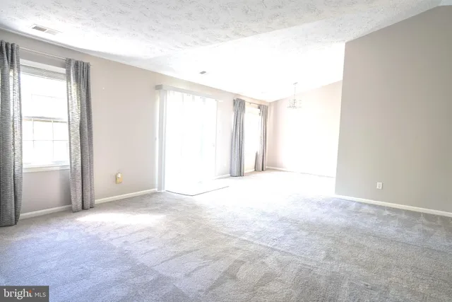a bathroom with a double vanity sink toilet and a mirror
